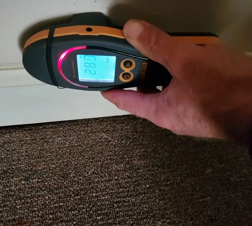 Moisture detection at baseboard during Burst Pipe Cleanup in California Polytechnic State University
